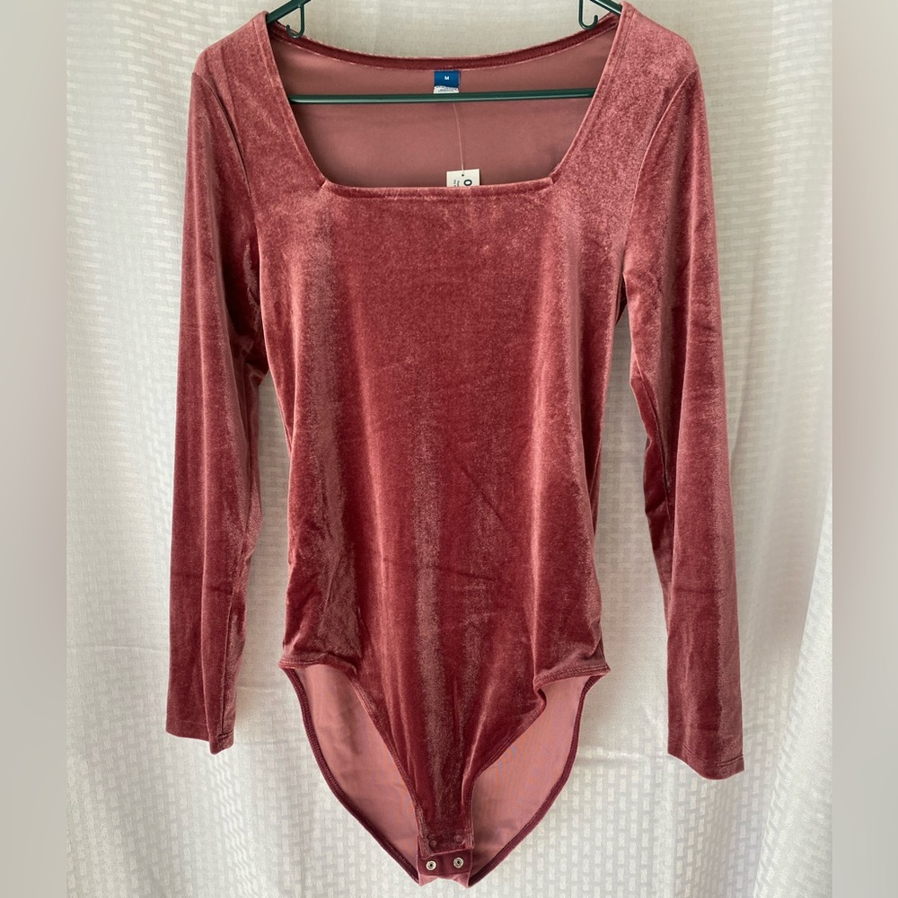 Rose colored long sleeve bodysuit